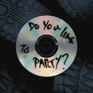 A Cracked CD with shoes surrounding it as if you were looking through a glass floor.